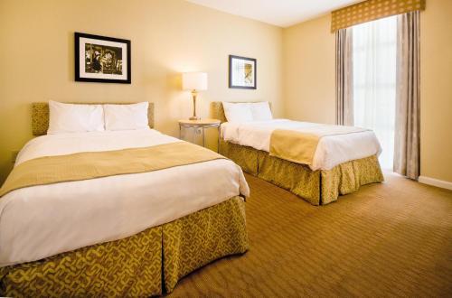 Un ou plusieurs lits dans un hébergement de l'établissement Wyndham Ocean Boulevard 3BR Apartment with Resort Access