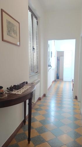 a hallway with a table and a tile floor at ORVIETO BRICK HOUSE in Orvieto Scalo