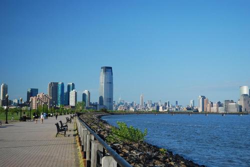a view of a city with a river and buildings at NEW! Historic Townhouse-14 min to WTC in Jersey City