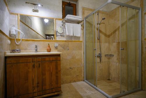a bathroom with a shower and a sink at Harman Cave Hotel in Goreme