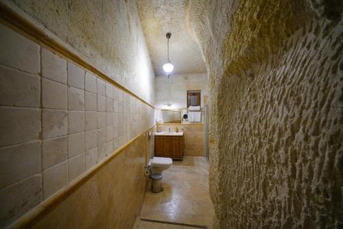 a bathroom with a toilet and a sink at Harman Cave Hotel in Goreme