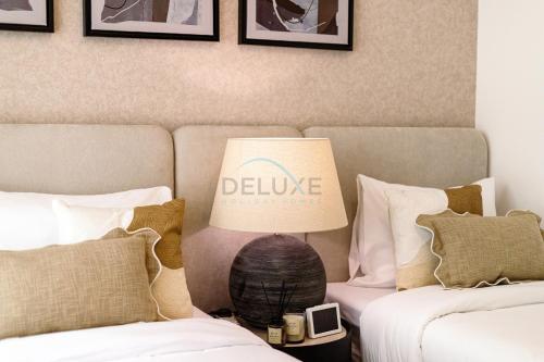 Cama o camas de una habitación en Stunning Sea Views from the Private Pool, Mins Away from Pristine Beaches and Key Fujairah Attractions, Sharm Al Dana Villa, Fujairah by Deluxe Holiday Homes