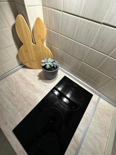 a kitchen counter with a toilet and a wooden bench at The Lumen in Nea Chili