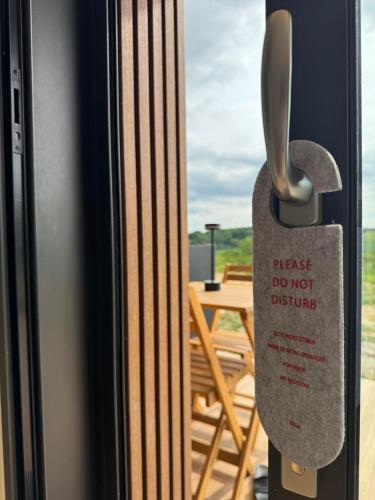 a sticker on the door of a refrigerator at Le Domaine de la Vallée in Vernon