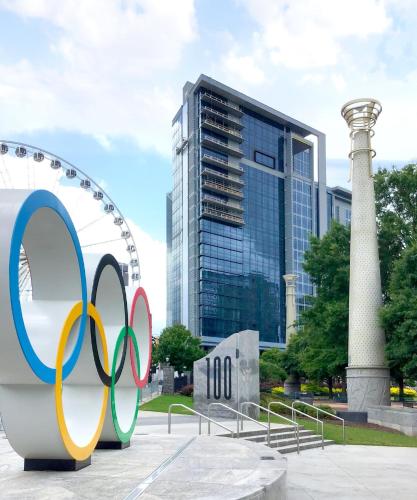 a sculpture of the olympics in front of a tall building at Wyndham Margaritaville Resort 2BR Apartment with Resort Access in Atlanta