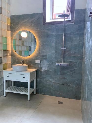 a bathroom with a sink and a mirror at Comfortable Room in Historic Casa Quesada Shared House in Las Palmas de Gran Canaria