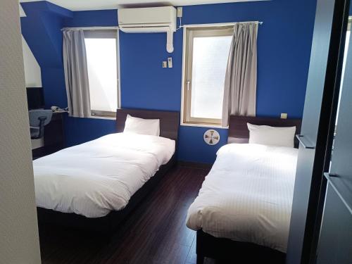 Postel nebo postele na pokoji v ubytování Ace Inn Asakusa