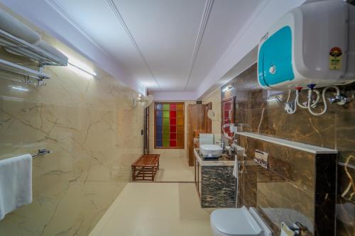 a bathroom with two sinks and two toilets at The Kurki Heritage in Jaipur