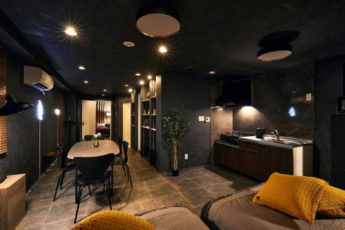 a room with a kitchen and a table in it at Hotel-Mercurius-Azabujuban-RB in Tokyo
