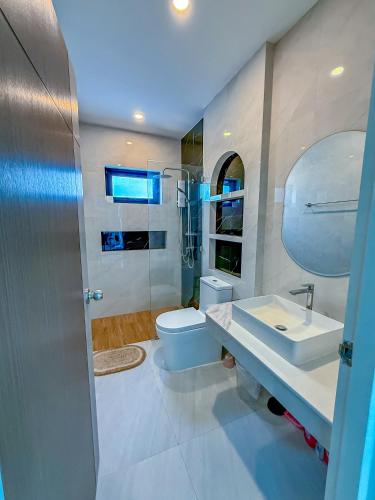 a bathroom with a sink and a toilet at N&C Mountain Pool Villa Huahin in Hua Hin