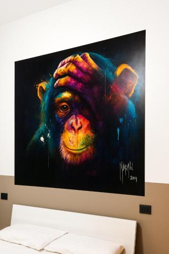 a painting of a chimpanzee on a wall at Casa vivace in centro Torino by Turin House Collection in Turin