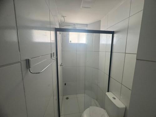 a bathroom with a shower and a toilet at BSH FLATS - Melhor custo benefício in Campina Grande