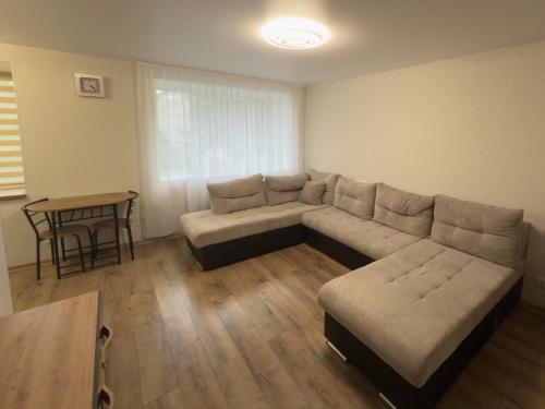 a living room with a couch and a table at Soldino Apartments in Narva
