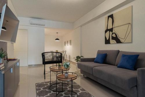 a living room with a couch and a table at Fliphaus Moreno 550 'A' Loft with Pool in Plaza de Mayo in Buenos Aires