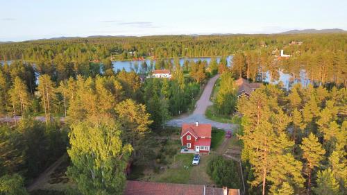 an aerial view of a house in a forest at Hus Siknäs in Mora