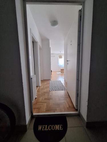 an empty hallway with a door to a room at Amar6 in Novi Beograd