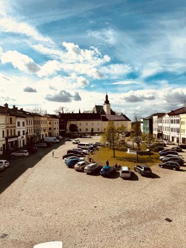 a group of cars parked in a parking lot at ART hotel MAXIM in Frýdek-Místek