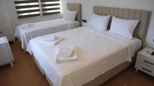 Postel nebo postele na pokoji v ubytování Kaşhan Otel