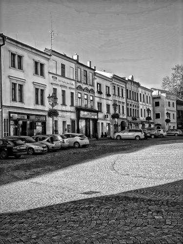 a group of cars parked in front of buildings at ART hotel MAXIM in Frýdek-Místek