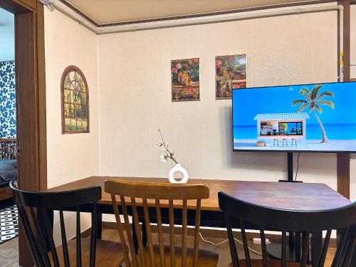 a dining room with a table and chairs at Daegu Stay Hoya in Daegu