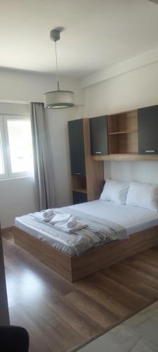 a bedroom with a large bed in a room at Apartments BUBBLES with pool in Gevgelija