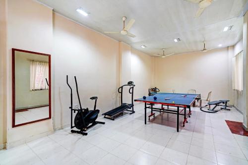 a room with a ping pong table and exercise equipment at Palette - Pagoda Resorts in Cochin