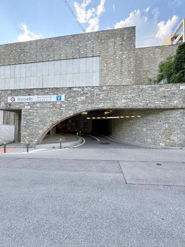 a large brick building with a tunnel in it at Gritti Palace Morcote - Vaniglia in Morcote