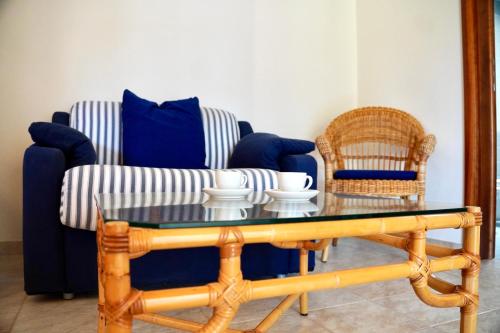 a living room with a table and two chairs at Suite & Sea - Apulian Stay Group in Rome