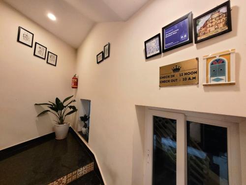 a hallway of a building with a tv on the wall at The Regal Luxury Boutique Stays in Majorda