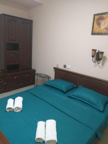 Postel nebo postele na pokoji v ubytování Sherlock Hotel