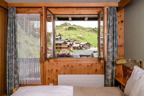 Postel nebo postele na pokoji v ubytování Hotel Alpfrieden