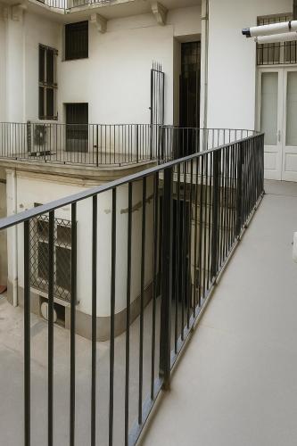 a balcony with black railing in a building at Casa vivace in centro Torino by Turin House Collection in Turin