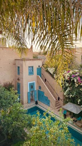 an aerial view of a house with a swimming pool at Palais Oumensour in Taroudant