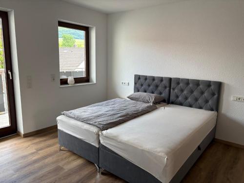 Postel nebo postele na pokoji v ubytování Kegelspiel Apartments