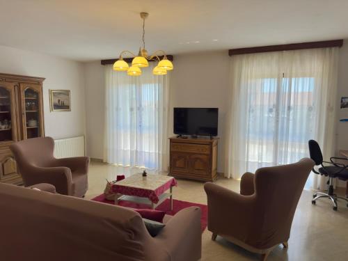 TV a/nebo společenská místnost v ubytování Apartman Ostrea ***
