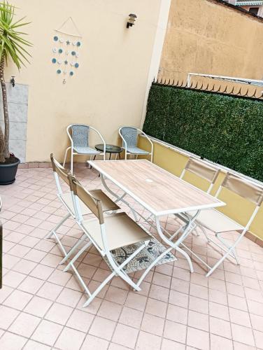 a table and chairs sitting on a patio at L'alcova del Mare in Alassio