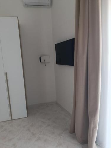 TV a/nebo společenská místnost v ubytování Elysium Guesthouse