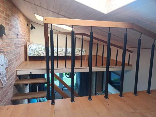 a small room with a bunk bed in a building at Domek Sasino in Sasino