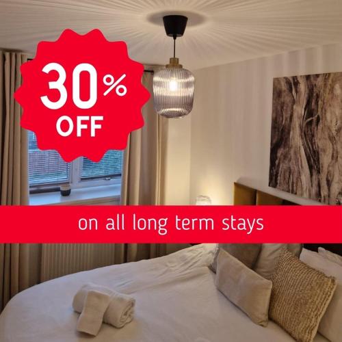 a red sign that says percent off on a bed at Charming 2 Bed House - Family Friendly in Nottingham