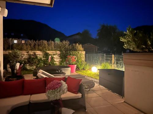 a backyard patio at night with a couch at Enjoy The Alps in Flachau