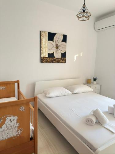 Ένα ή περισσότερα κρεβάτια σε δωμάτιο στο Olive House Seaside