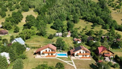 an aerial view of a house on a hill at Friends & Family Moieciu in Moieciu de Jos