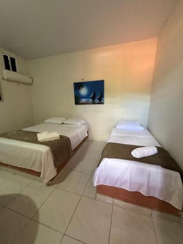 Ένα ή περισσότερα κρεβάτια σε δωμάτιο στο Casa Marelle