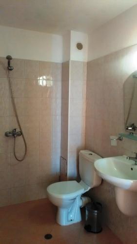 a bathroom with a toilet and a sink at Guest House Malkata Stopanka in Primorsko