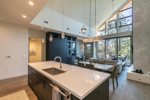 a kitchen with a sink and a dining room at Crystal Bay Penthouse 301 condo in Crystal Bay