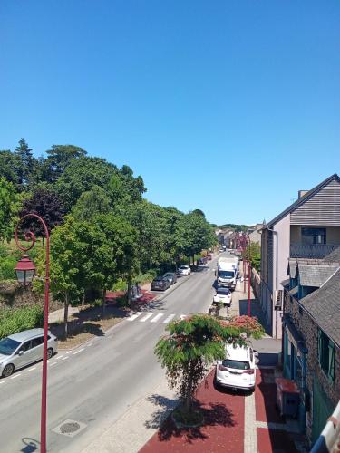 an overhead view of a street with cars parked on the street at Hotel Le Marrakech in Châteauneuf-dʼIlle-et-Vilaine