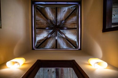 a window in a room with two lights on the wall at Kitesurf Paradise at Le Morne - Pool, Garden, Views in Le Morne