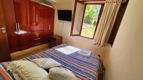 En eller flere senge i et værelse på Amanecer en los colorados