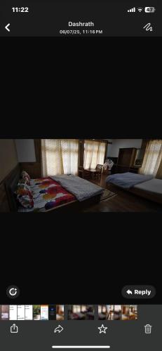 a picture of a bedroom with a bed in a room at Jimmys homestay in Leh