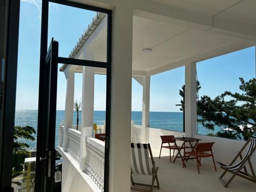 a view of the ocean from the balcony of a house at Pitna Guest House in K'obulet'i